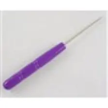 A purple plastic Pick-Up Sticker Needle on a white surface.