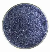 A bowl of 1118 Midnight Blue Transparent sand on a white background.