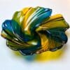Colorful glass dish with wavy design.