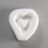 White heart-shaped dish with inner heart.