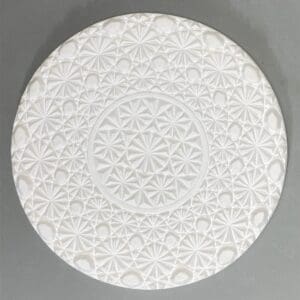 White textured plate with geometric patterns.