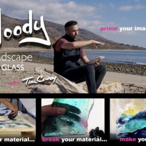 Man crafting glass landscape by ocean.