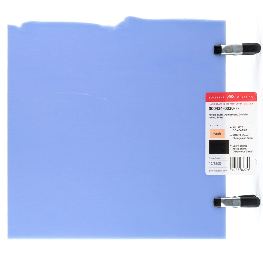 Light blue fabric swatch with tags and clips.